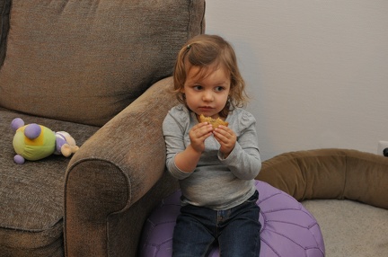 Greta worried eating her cookie